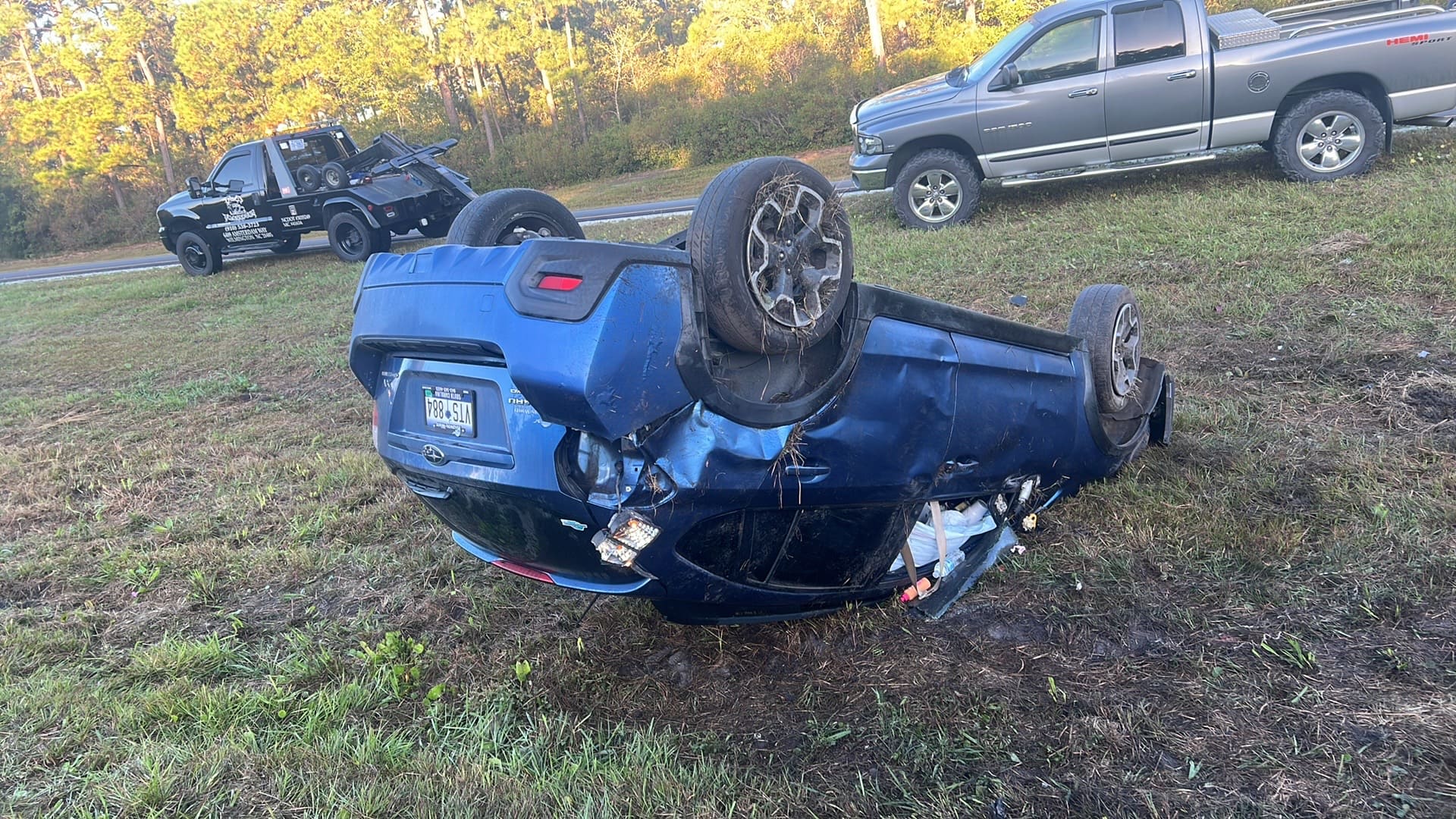 A car that has flipped over due to an accident